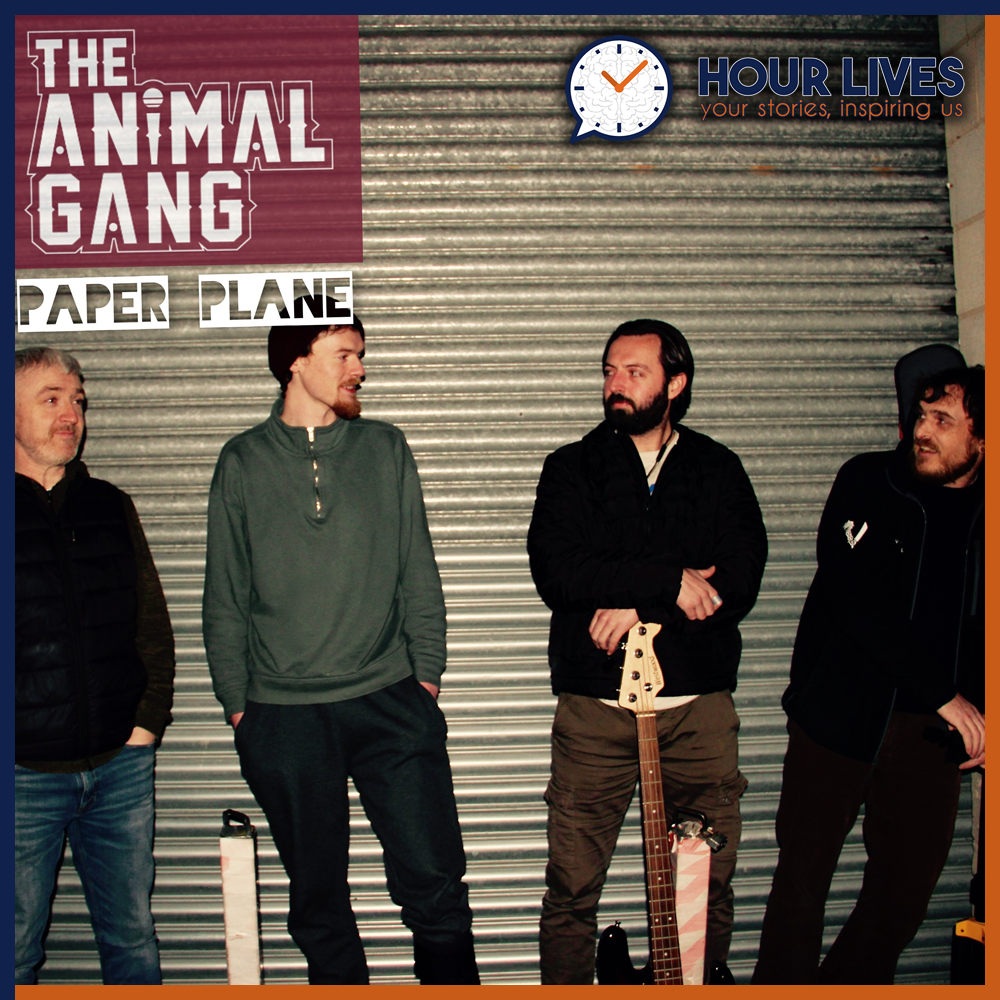 A photo of musicians The Animal Gang stood against a a metal shutter.